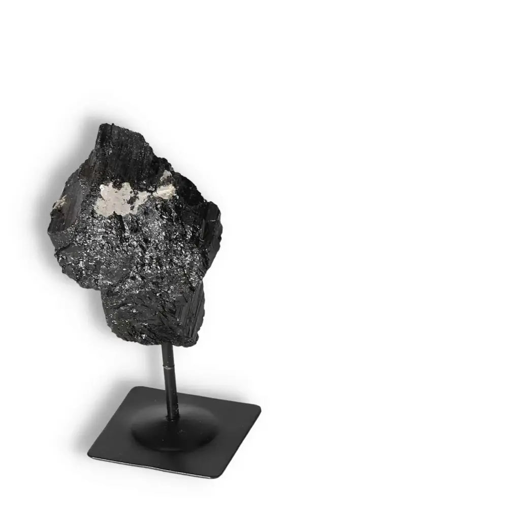 Rough Black Tourmaline with Metal Stand by Sylvia Crystals, a natural gemstone for purifying and grounding, enhancing concentration.