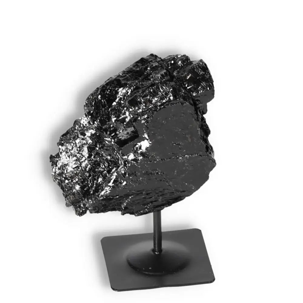 Rough Black Tourmaline with Metal Stand S from Sylvia Crystals, known for energy cleansing and grounding properties.