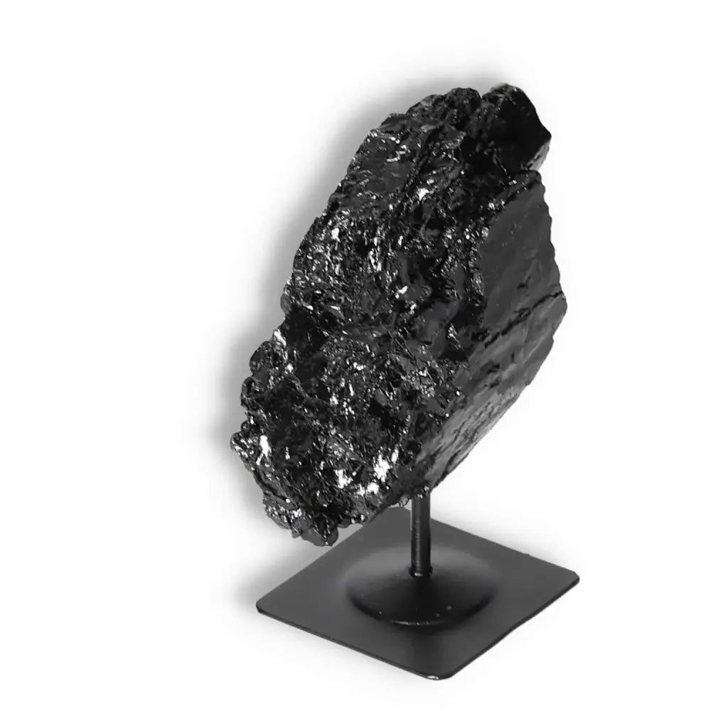 Rough Black Tourmaline on Metal Stand S from Sylvia Crystals, known for transforming negative energies into positive vibes.