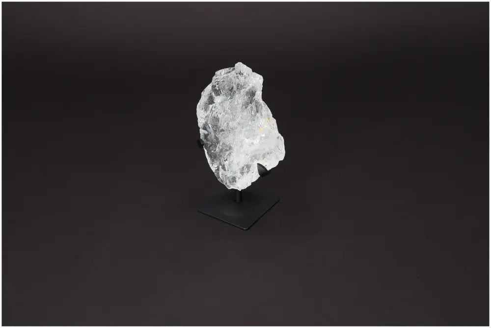 Elegant Rough Lemurian Quartz on metal stand, perfect for enhancing spiritual and home ambiance. Premium quality from Sylvia Crystals.