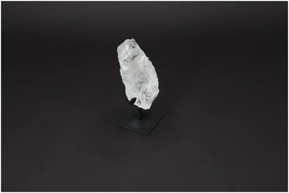 Rough Lemurian Quartz on metal stand, showcasing natural elegance and spiritual depth from Sylvia Crystals.