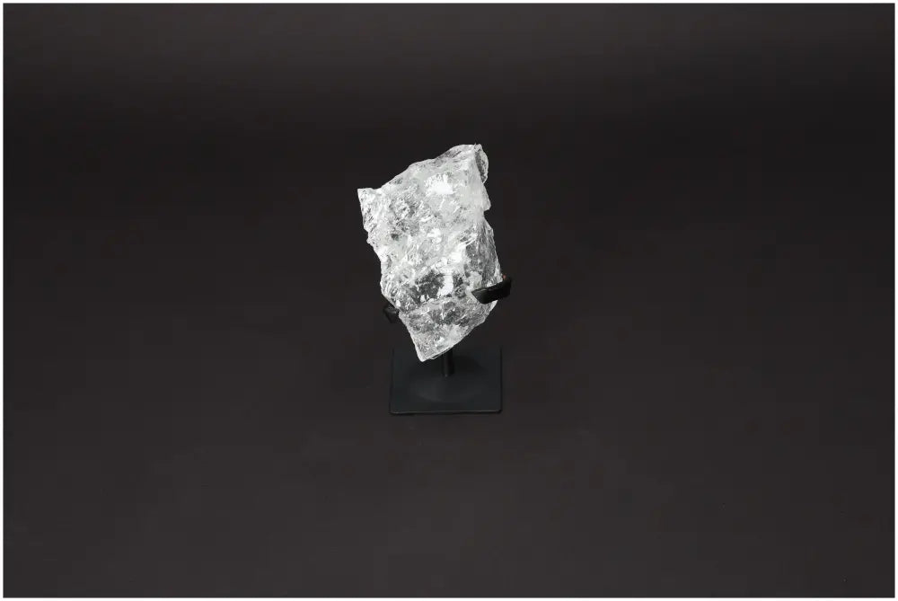 Rough Lemurian Quartz on metal stand, premium Sylvia Crystals product known for purification and harmonizing energy.