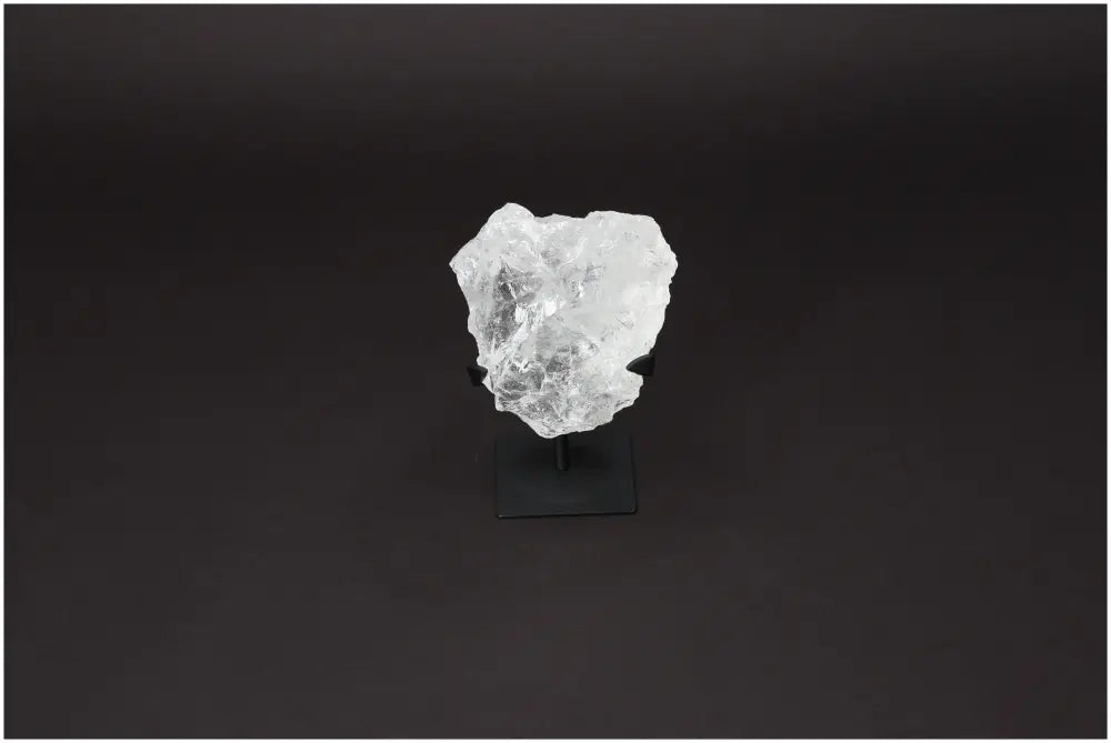 Rough Lemurian Quartz on metal stand, featuring clear crystal design, from Sylvia Crystals for purification and harmonious living.