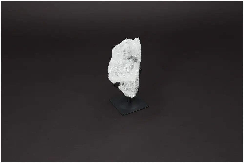 Rough Lemurian Quartz on elegant metal stand, premium clear crystal for energy balance and purification, by Sylvia Crystals.