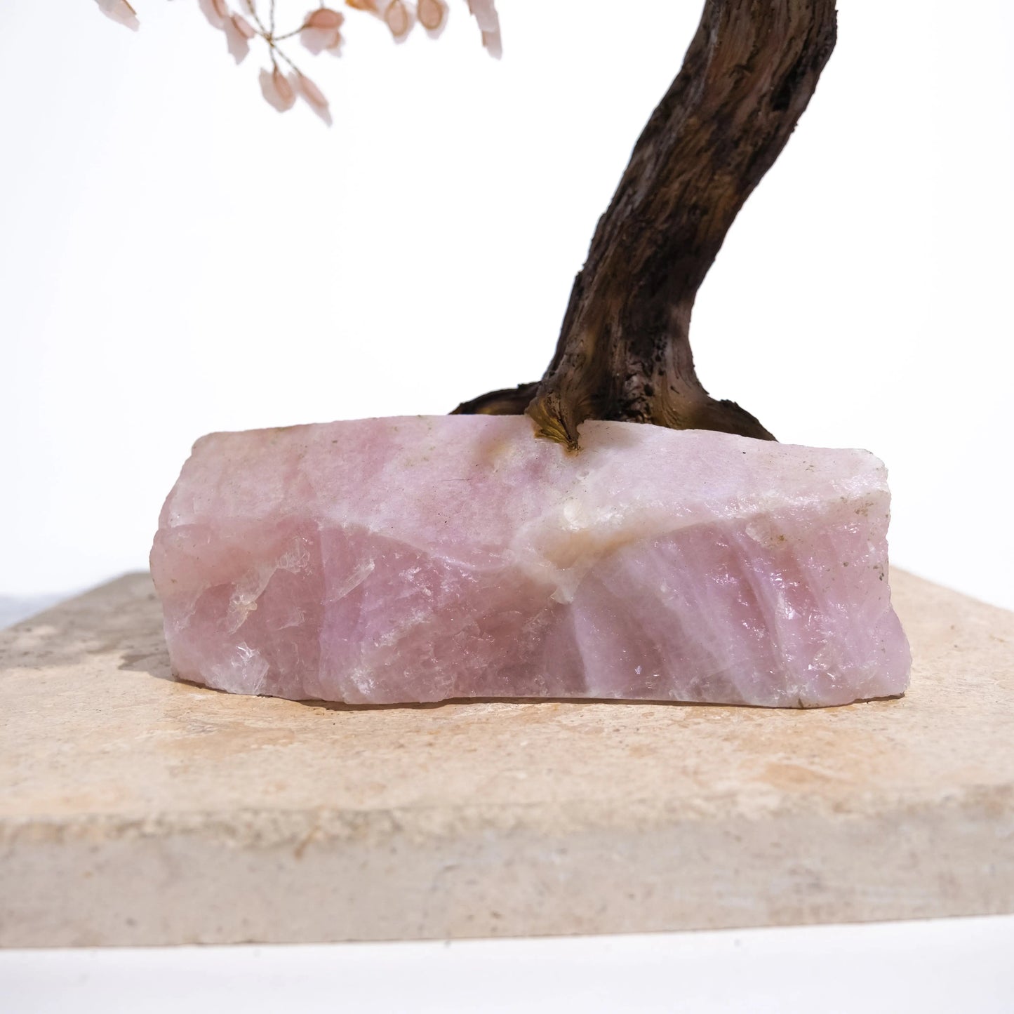 Quartz Crystal Bonsai Tree base with pink rough quartz gemstone and handcrafted wire branches, enhancing home décor and positive energy.