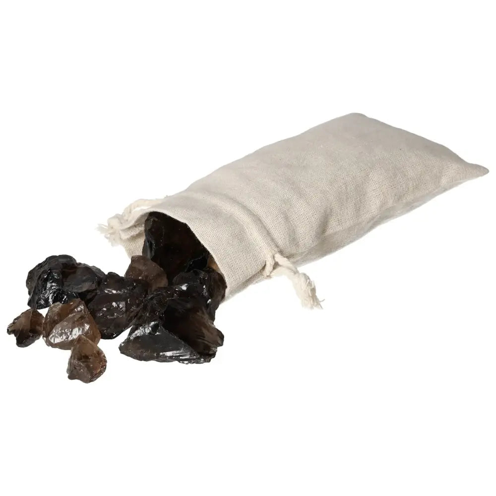 Rough Smoky Quartz gemstones spilling from a linen bag, showcasing their elegant and grounding properties for clarity and practical thinking.