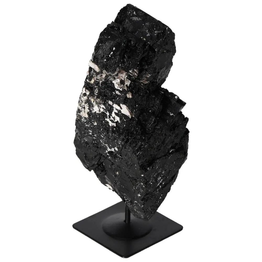 Rough Tourmaline With Metal Stand by Sylvia Crystals showcasing its natural elegance and vibrant hues for interior decor.