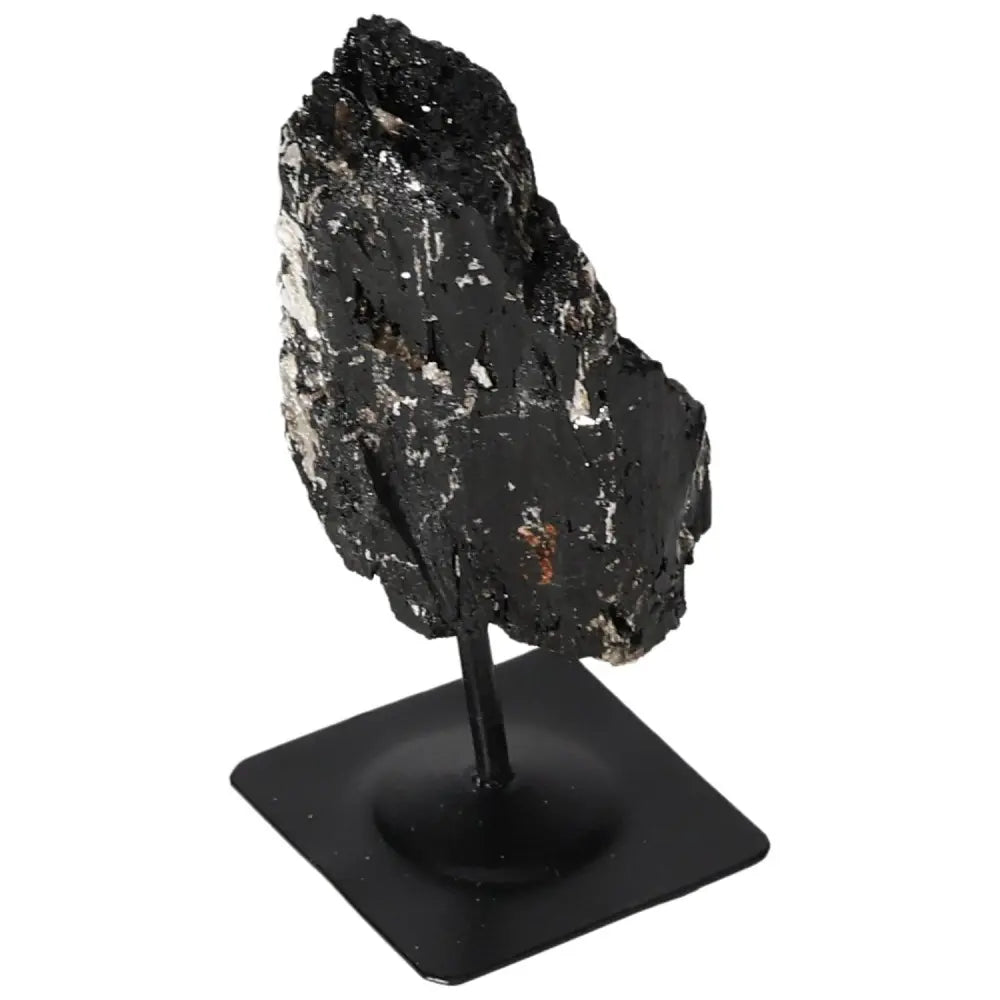 Rough Tourmaline on sleek metal stand, a luxury Sylvia Crystals piece blending natural beauty and modern design for elegant decor.