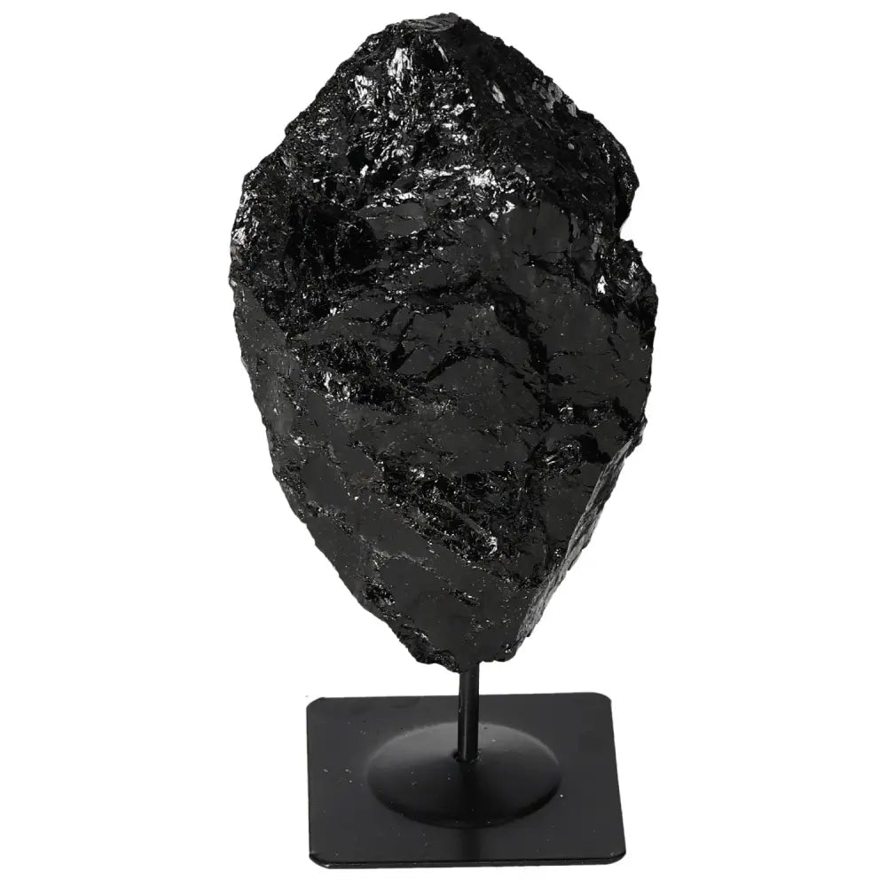 Exquisite rough tourmaline with metal stand, designed by Sylvia Crystals, showcasing unique charm and mystical benefits.