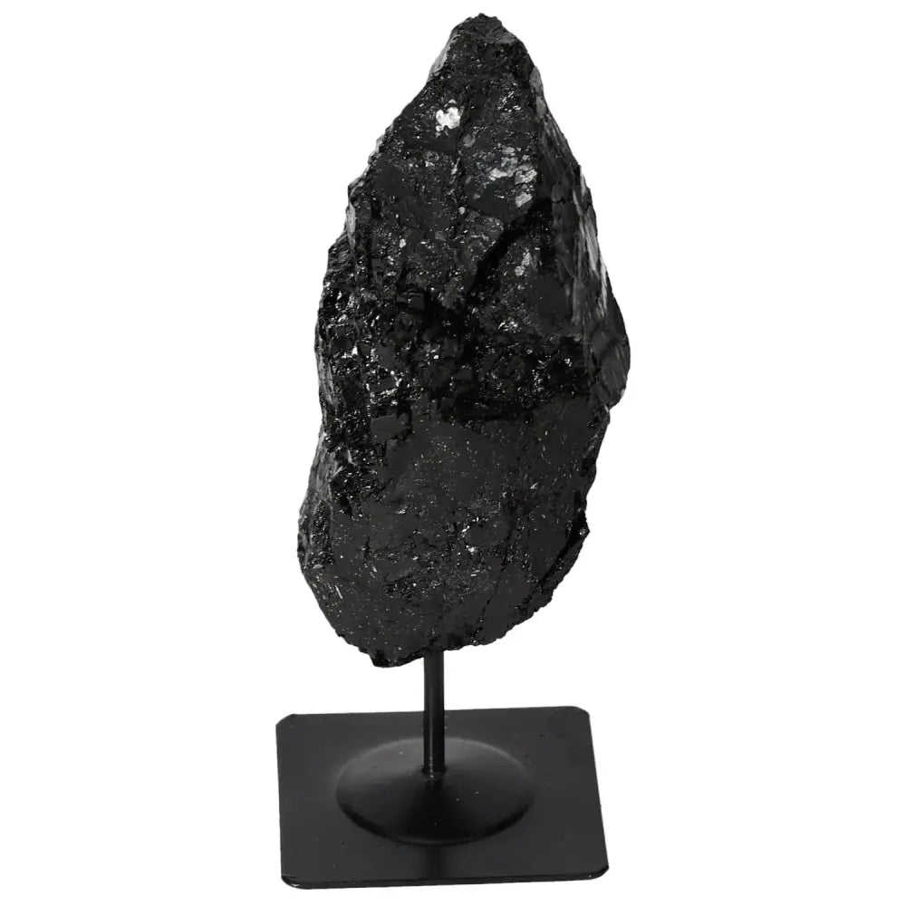 Rough tourmaline with metal stand, exclusive Sylvia Crystals design, enhances interiors with its unique charm and mystical benefits.