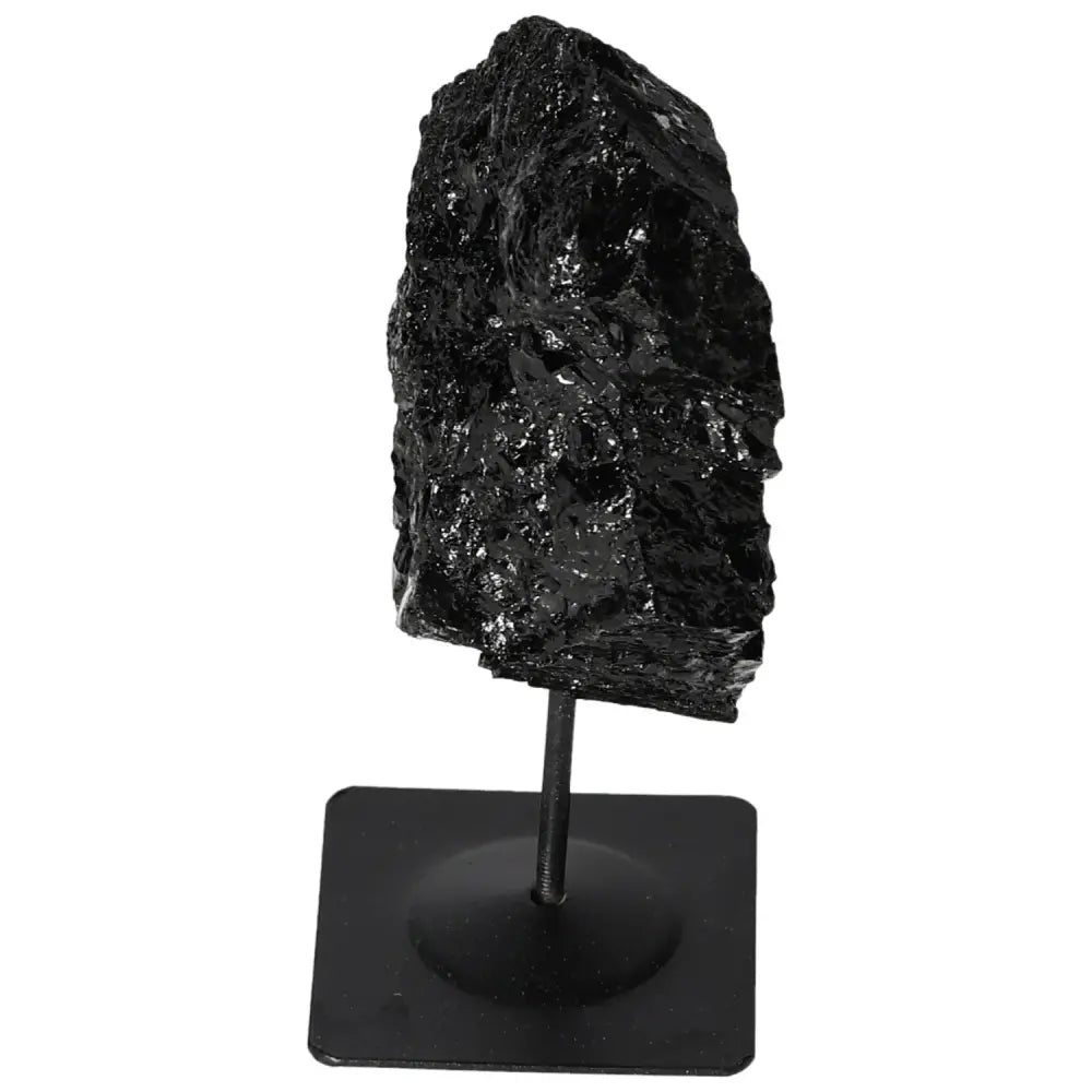 Rough Tourmaline on Metal Stand by Sylvia Crystals, showcasing its natural black luster. Ideal for crystal collectors.