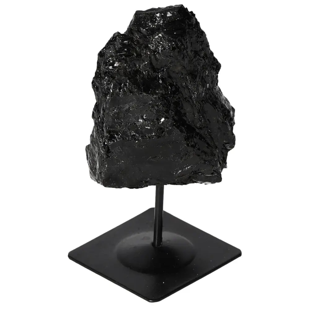 Rough tourmaline crystal on metal stand, showcasing deep black hues and natural textures. Ideal for home decor and energy balancing.