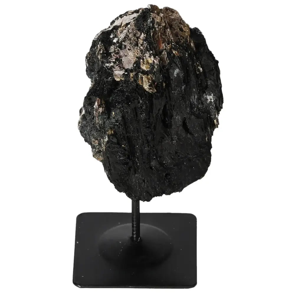 Rough tourmaline on sophisticated metal stand showcasing natural elegance and mystique, ideal centerpiece from Sylvia Crystals.
