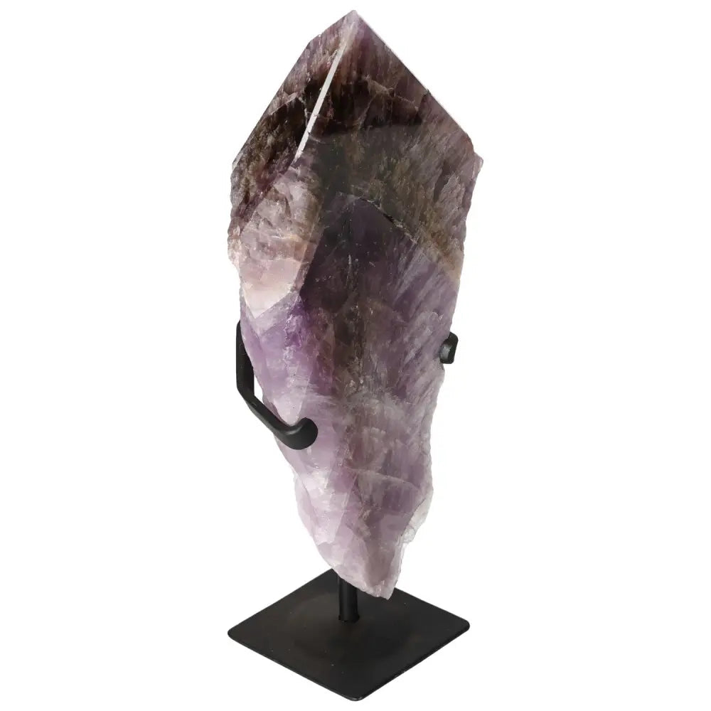Seven Point Polished Amethyst on a stand, showcasing its luxurious purple hues, symbolizing spirituality and mindful living by Sylvia Crystals.