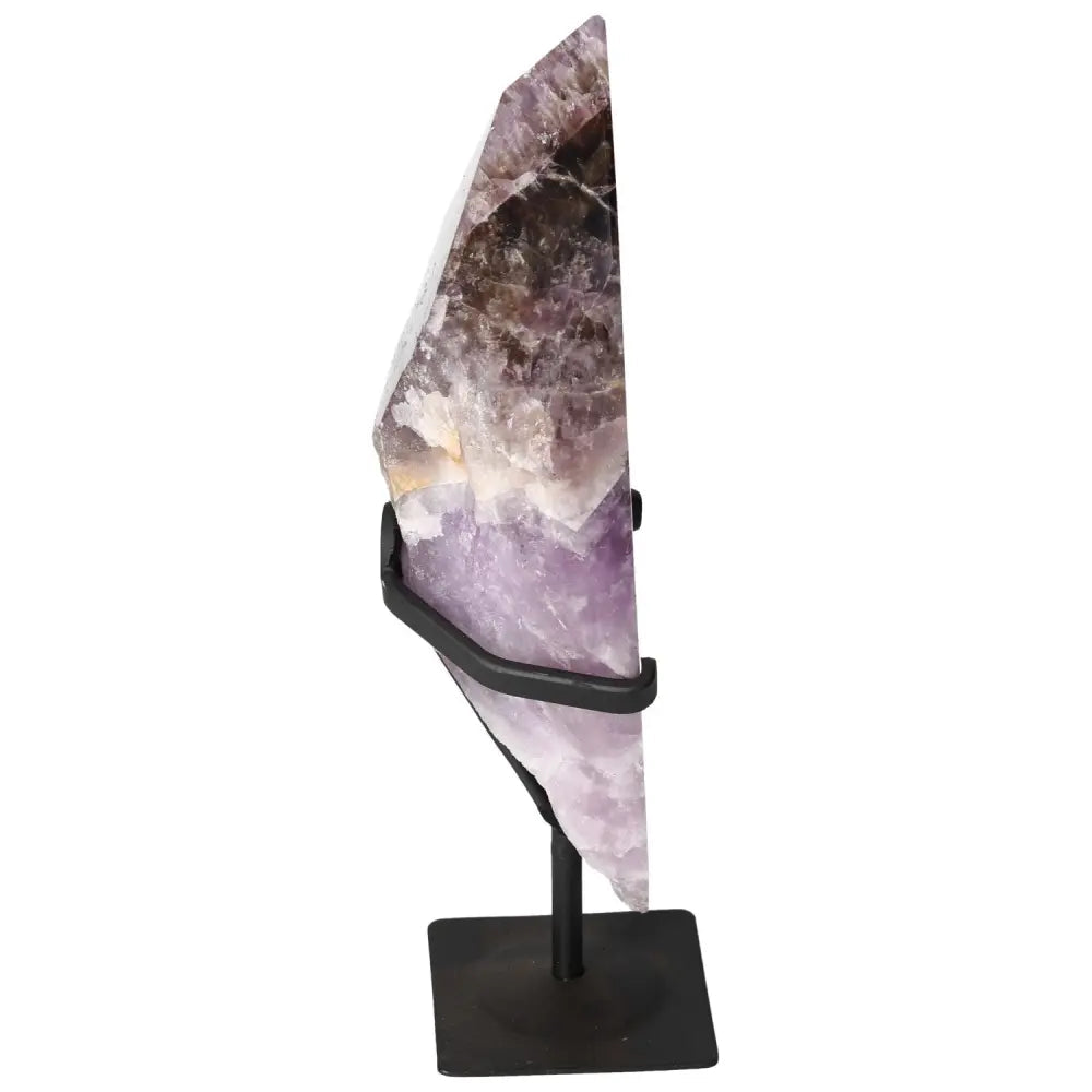 Seven Point Polished Amethyst crystal by Sylvia Crystals on metal stand, symbolizing luxury and spirituality.