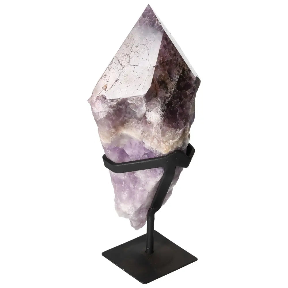 Seven Point Polished Amethyst from Sylvia Crystals, a luxurious crystal for stress relief and mindful living, on display stand.