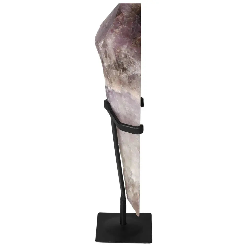 Side view of a Seven Point Polished Amethyst on a stand, showcasing its exquisite craftsmanship and natural beauty from Sylvia Crystals.