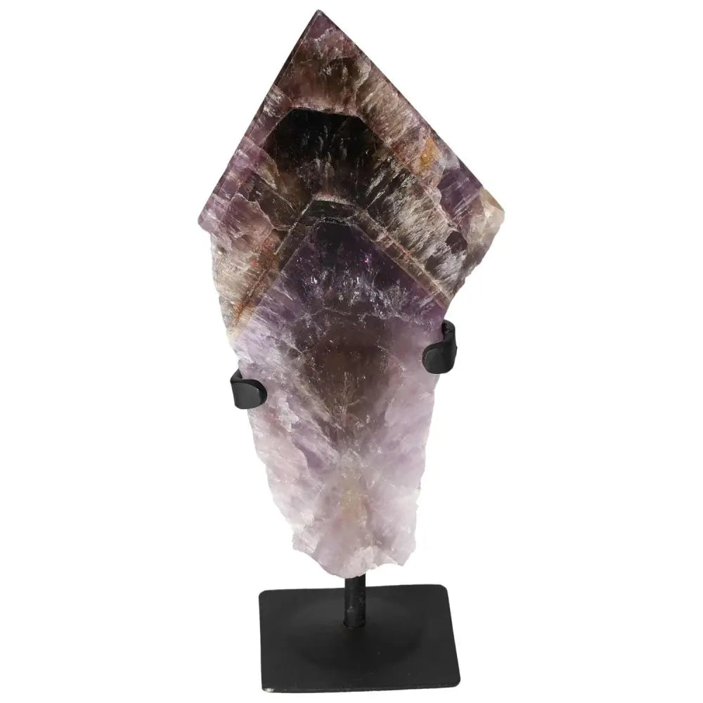 Seven Point Polished Amethyst crystal from Sylvia Crystals, known for energy-enhancing and stress-reducing qualities, on display stand.