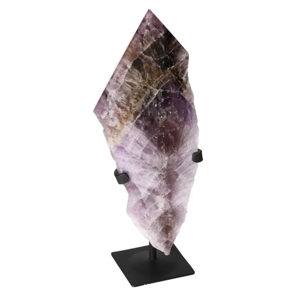 Seven Point Polished Amethyst crystal displayed on stand, promoting stress relief and emotional stability from Sylvia Crystals.