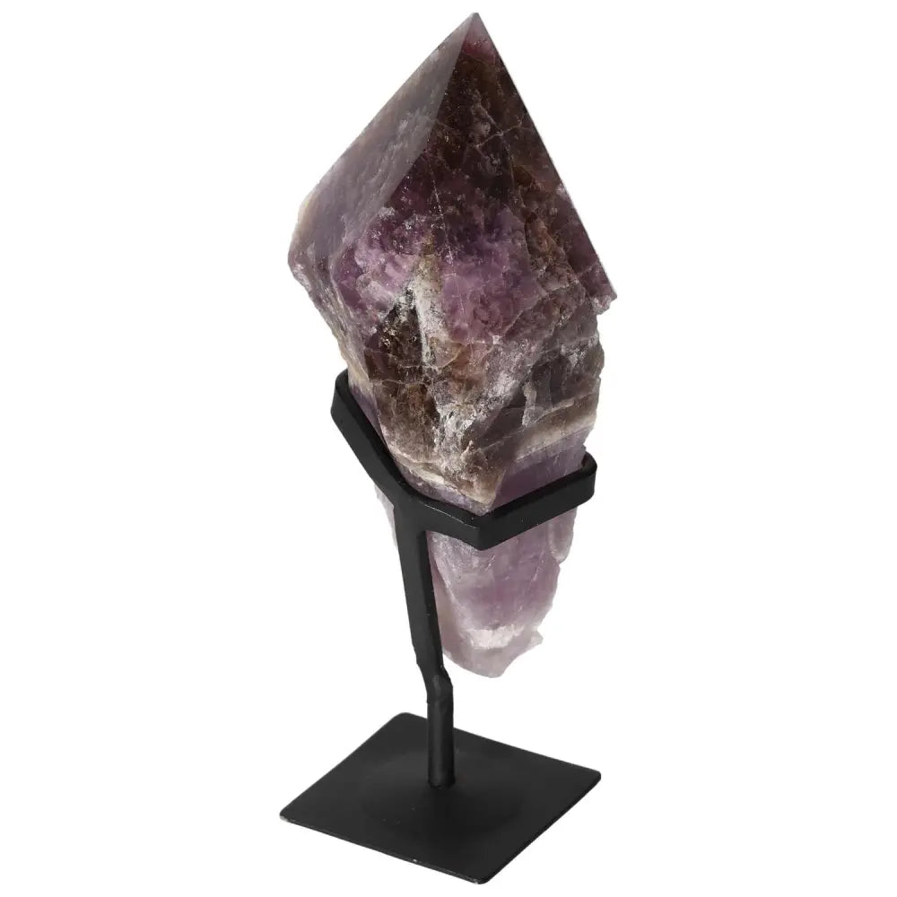 Seven Point Polished Amethyst on a stand, showcasing its luxurious purple hues and energy-enhancing properties from Sylvia Crystals.