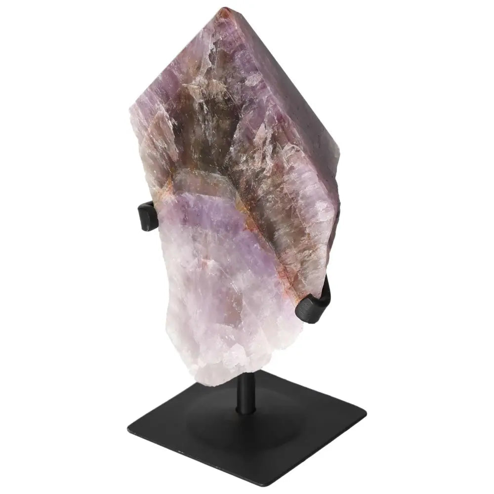 Seven Point Polished Amethyst from Sylvia Crystals on a stand, showcasing its exquisite beauty and spiritual energy.