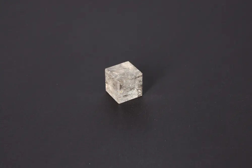 Smoky Quartz Cube 3 cm on black background, showcasing translucent tones and grounding energy for stability and transformation.