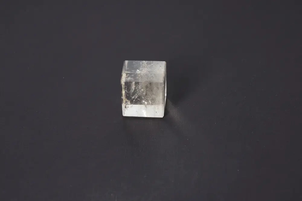 Smoky Quartz Cube 4 cm on dark background, showcasing its translucent tones and grounding energy properties.