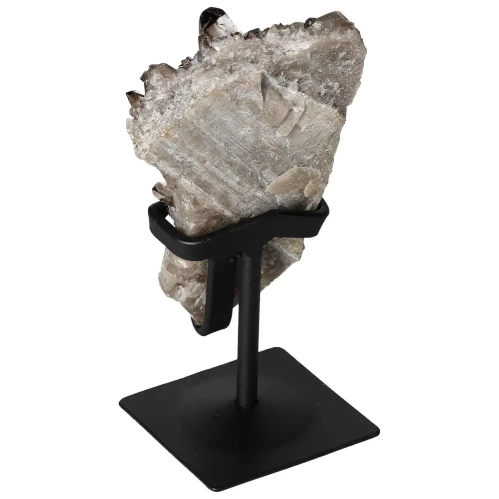 Smoky Quartz crystal on a metal stand from Sylvia Crystals, promoting elegance and grounding energies in home decor.