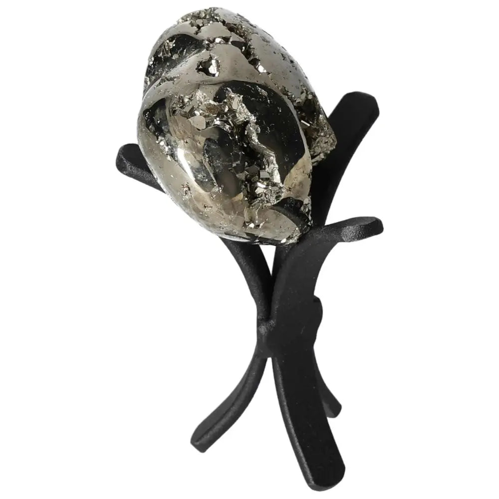 Superior Quality Pyrite Heart showcasing geometric brilliance and metallic luster, displayed on a black stand.