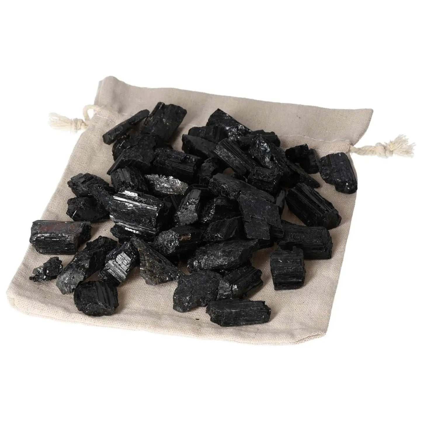 Tourmaline S 1 kg 80 pcs - Black prismatic crystals on beige bag, versatile gemstone for balancing energies.