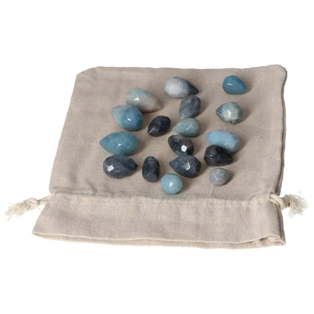 Trolleite small tear stones displayed on a burlap pouch, showcasing rich blue to violet hues for spiritual awareness and intuition enhancement.
