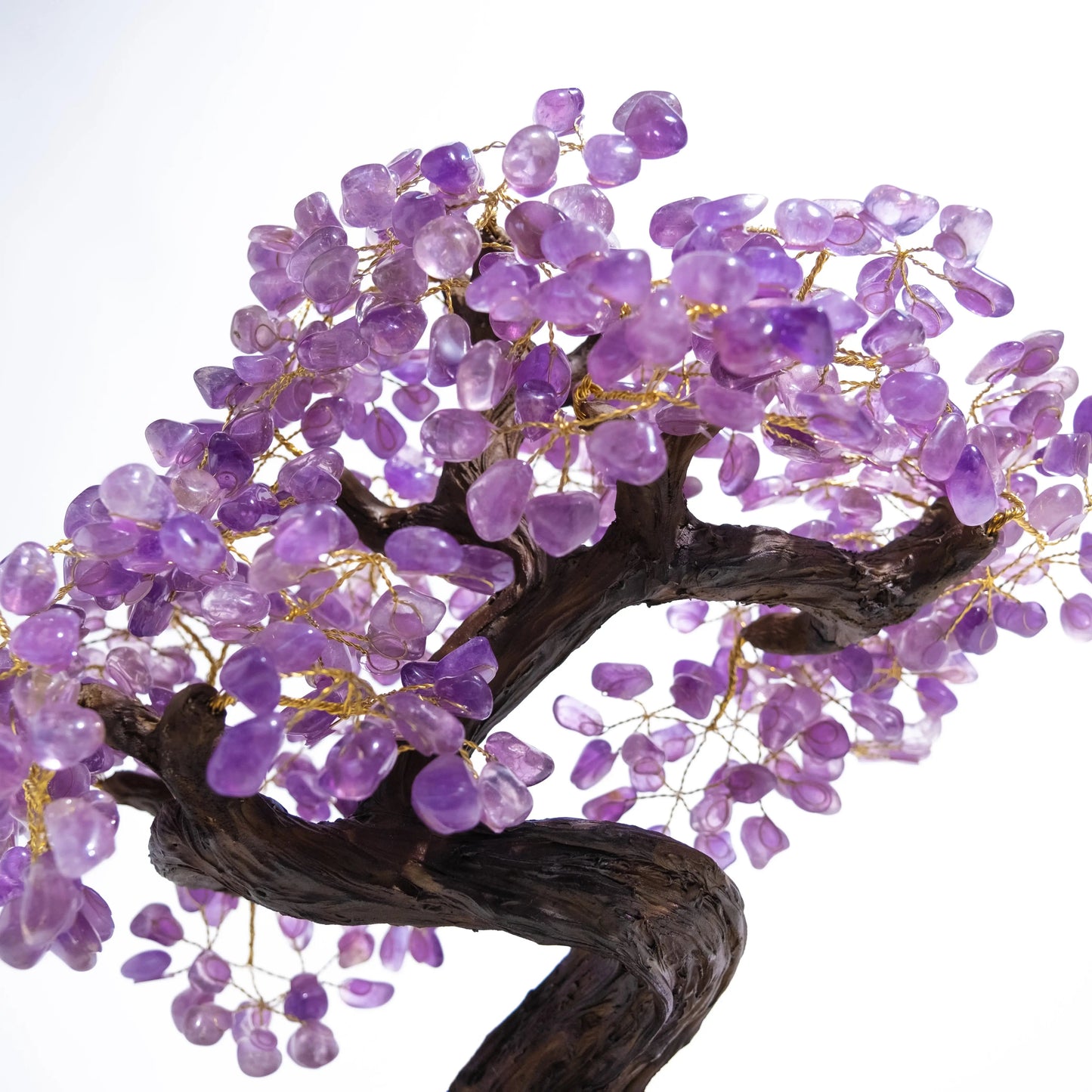 Elegant tumbled amethyst crystal bonsai tree with purple gemstone leaves for calming energy and spiritual harmony.