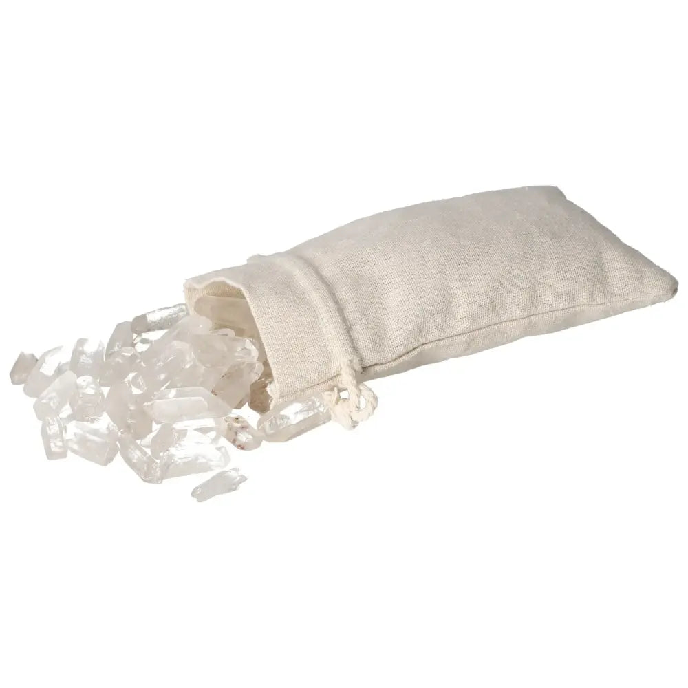 Tumbled Clear Quartz Points spilling from a fabric bag, symbolizing purity and energy harmonization from Sylvia Crystals.