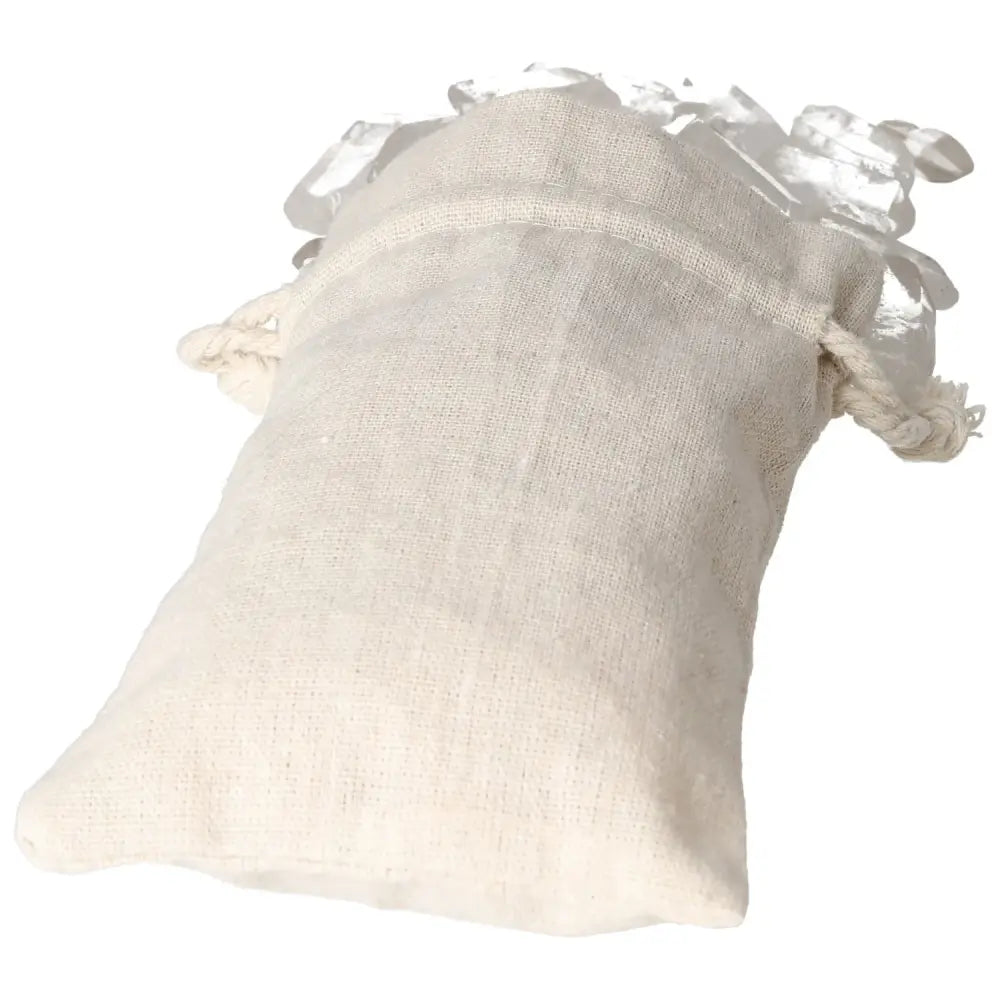 Tumbled Clear Quartz Point in a linen pouch, symbolizing purity and spiritual transformation from Sylvia Crystals.