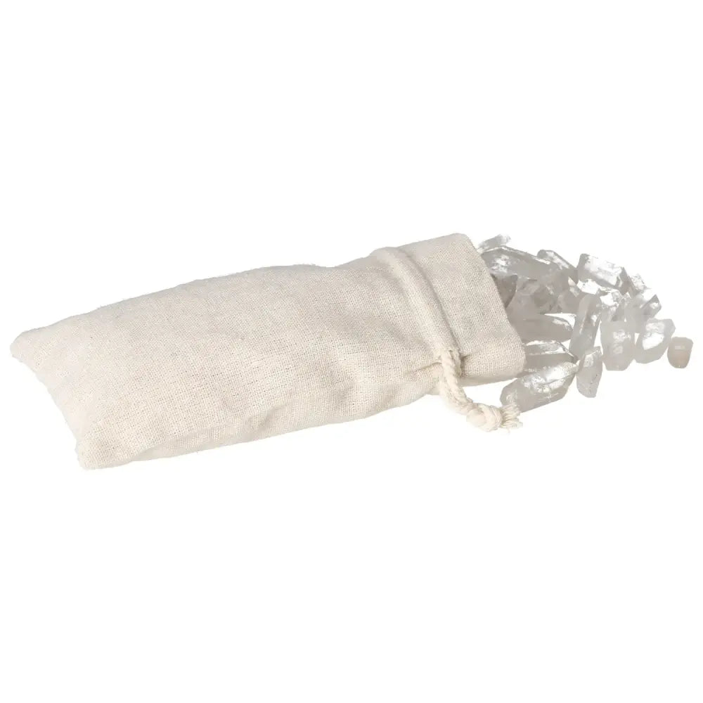 Tumbled Clear Quartz Points spilling from a natural fabric bag, symbolizing purity and balanced energy, from Sylvia Crystals.