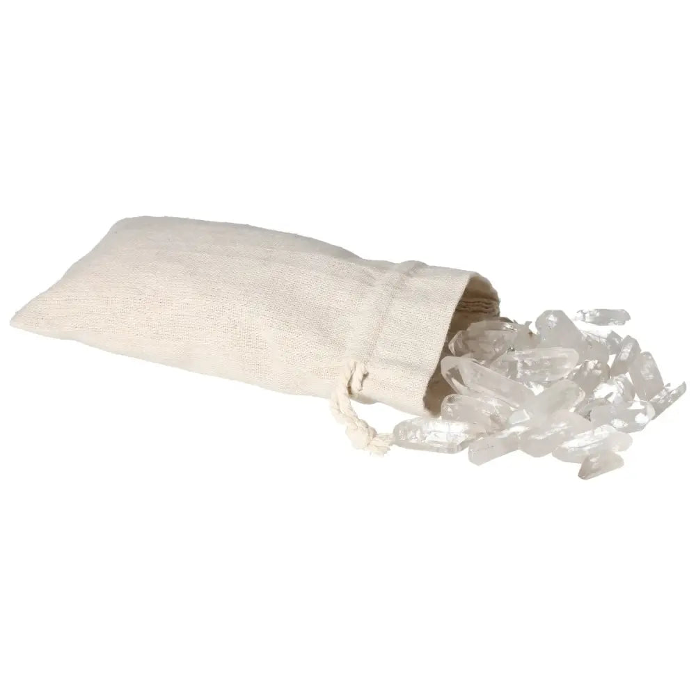 Bag of tumbled clear quartz points spilling out, showcasing purity and energy harmonization, represented by Sylvia Crystals.