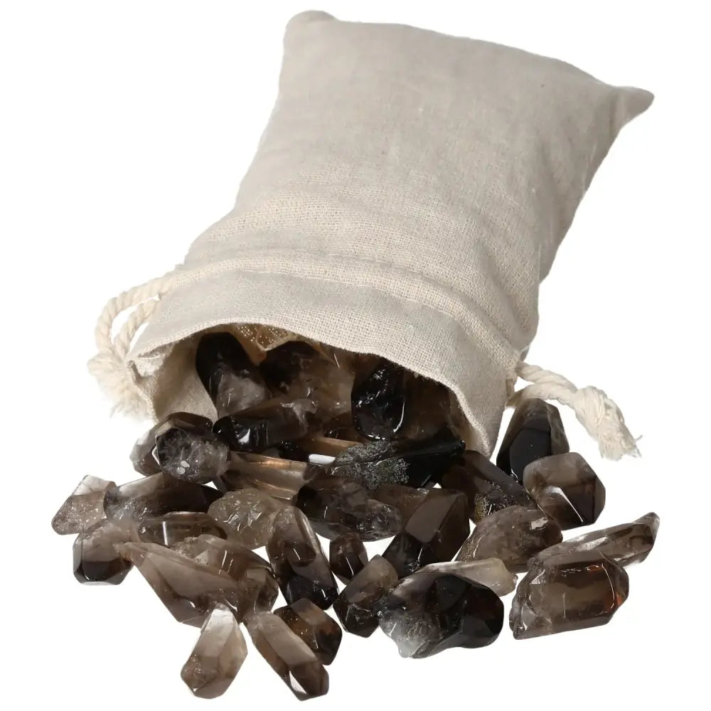 A collection of Tumbled Smoky Quartz Points spilling from a linen bag, ideal for collectors seeking luxury and grounding energy.