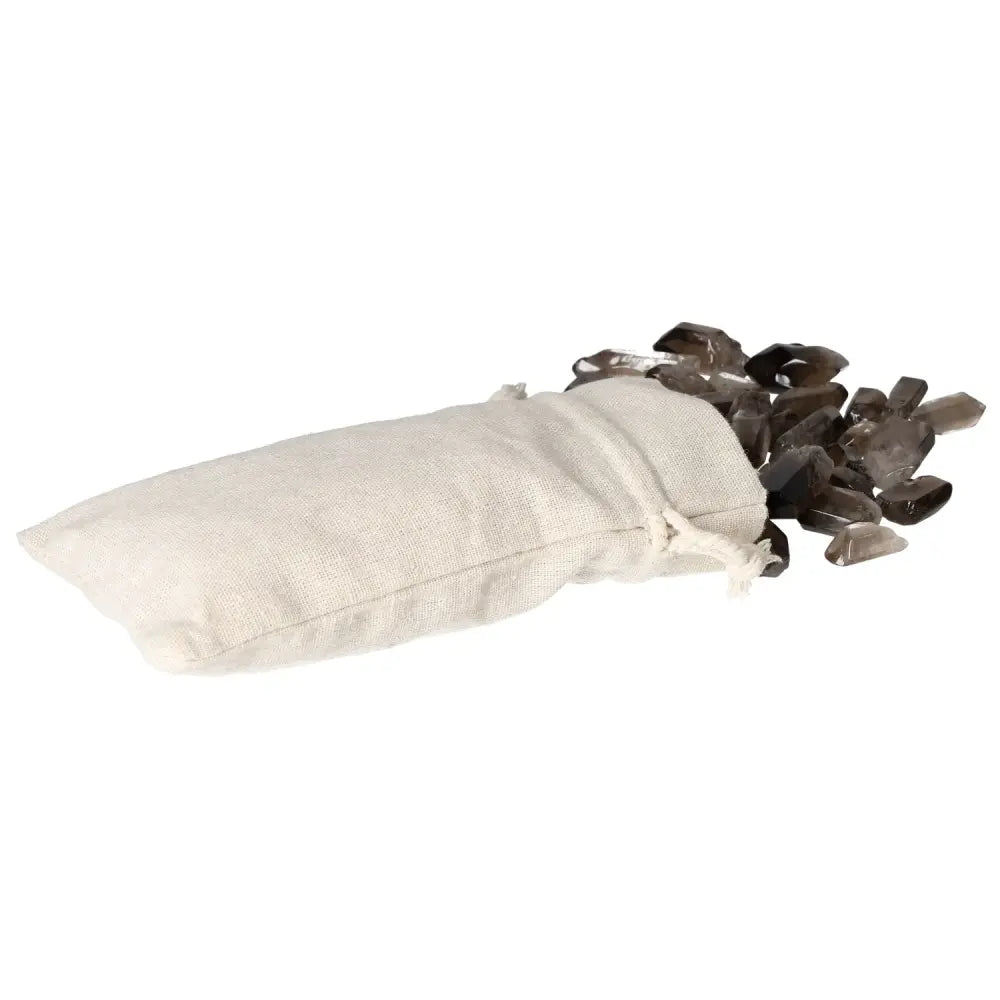 Bag of tumbled smoky quartz points spilling out on a white background, luxurious crystal by Sylvia Crystals for grounding and mindful living.