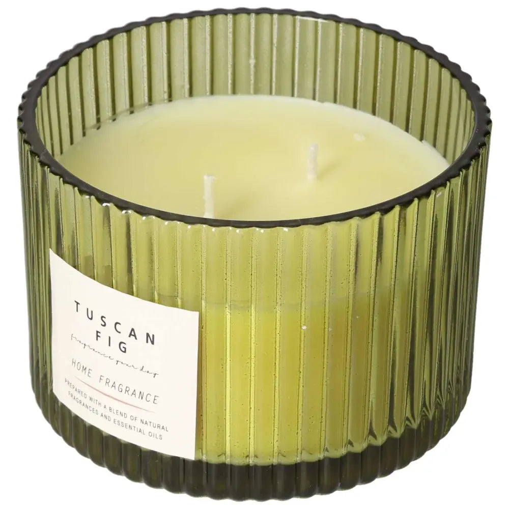 Tuscan Fig Scented Candle by Sylvia Crystals in green glass, emitting a rich fig aroma with amber, sandalwood, and green leaf notes.
