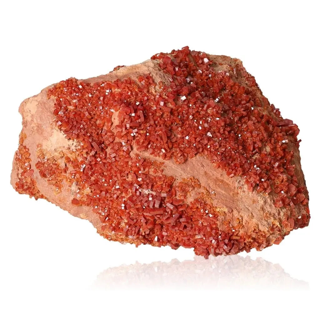 Vibrant red-orange vanadinite druzy, perfect for collectors or enhancing focus and creativity with its unique crystal formations.