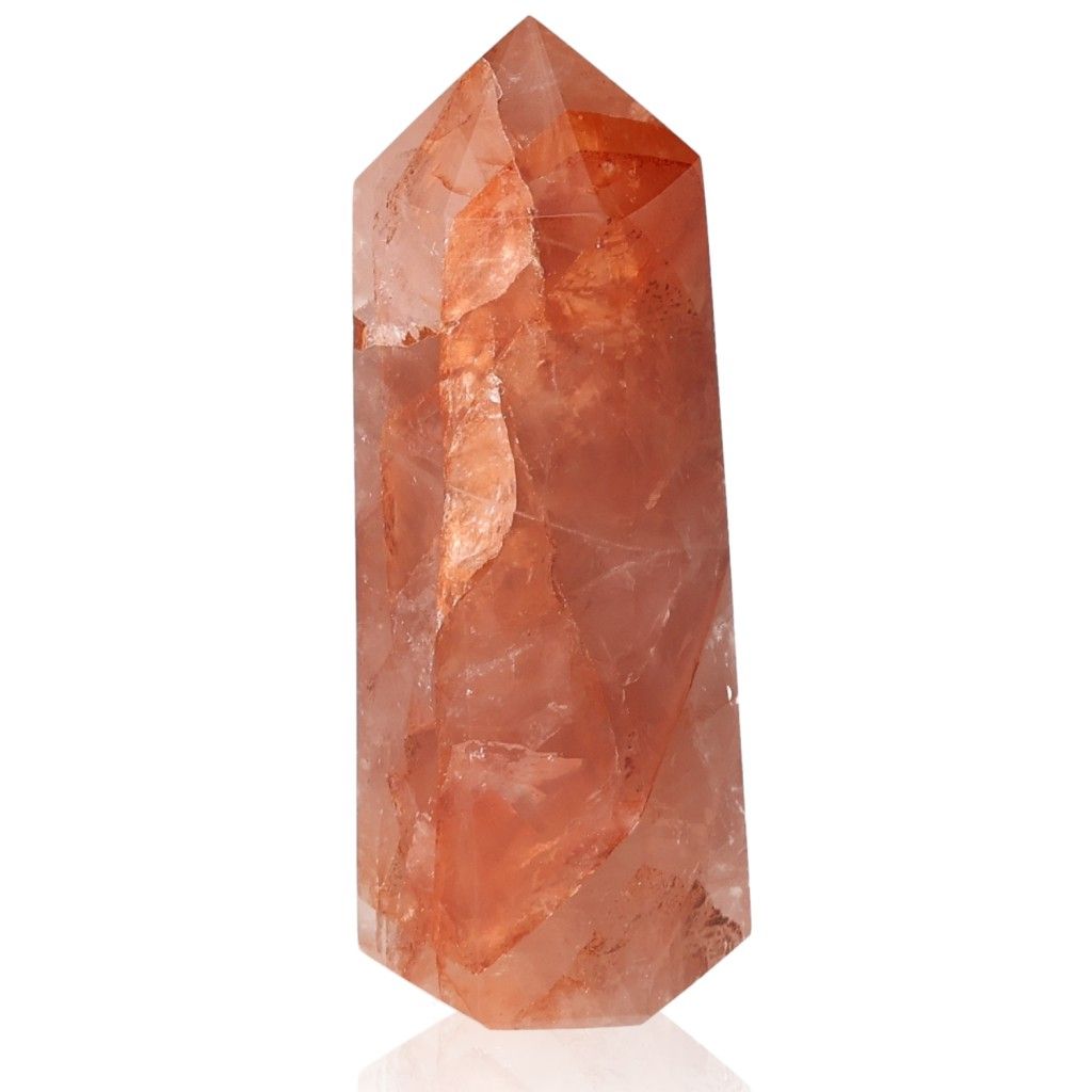 Red Calcite Tower crystal for energy balance, linked to chakras and zodiac signs, enhancing body and soul wellness.