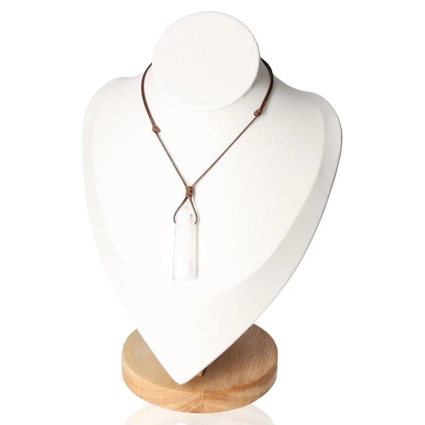Boho Necklace with Clear Quartz Pendant enhancing bohemian elegance and tranquility, displayed on a wooden stand.
