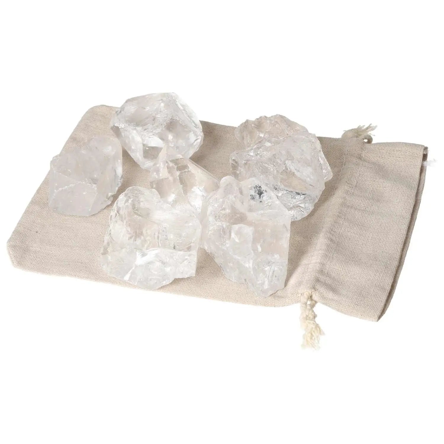 Quartz Clear crystals on a beige cloth, showcasing their clarity and elegance; perfect for enhancing spiritual harmony and balance.