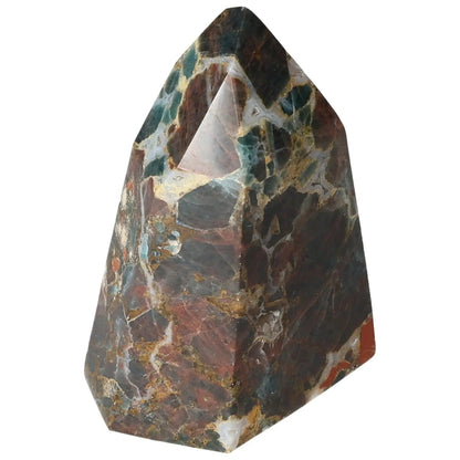 Apatite Obelisk crystal with blue hues, enhancing meditation, by Sylvia Crystals. A decorative piece symbolizing clarity and introspection.