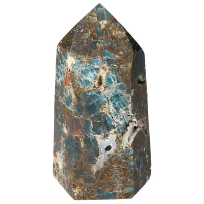 Apatite Obelisk by Sylvia Crystals, showcasing luxurious blue and brown hues, symbolizing harmony and energy in a decorative form.