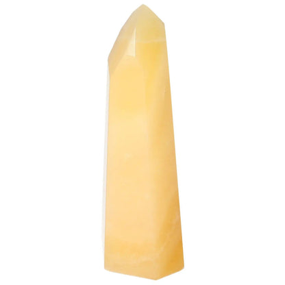 Mexican Calcite Obelisk from Sylvia Crystals, boosts self-confidence and enhances motivation, luxury crystal for personal growth.
