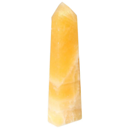Mexican Calcite Obelisk from Sylvia Crystals, enhancing self-confidence and luxury aesthetic for spiritual spaces.