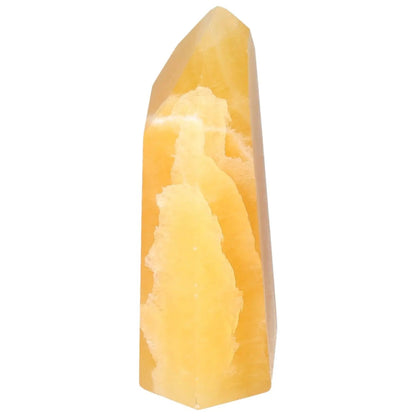 Mexican Calcite Obelisk by Sylvia Crystals, a luxury crystal for enhancing self-confidence and personal development.