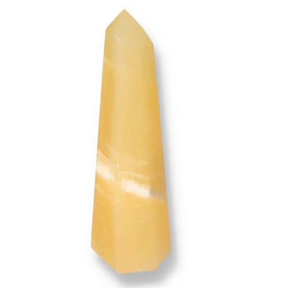 Mexican Calcite Obelisk from Sylvia Crystals. Premium quality, handpicked crystal, enhancing aesthetics and promoting conscious living.