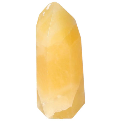 Mexican Calcite Obelisk from Sylvia Crystals, enhancing self-confidence and luxury in conscious living spaces.